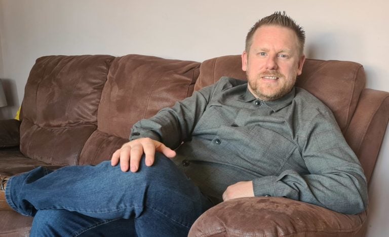 Kevin Williams sitting on a couch